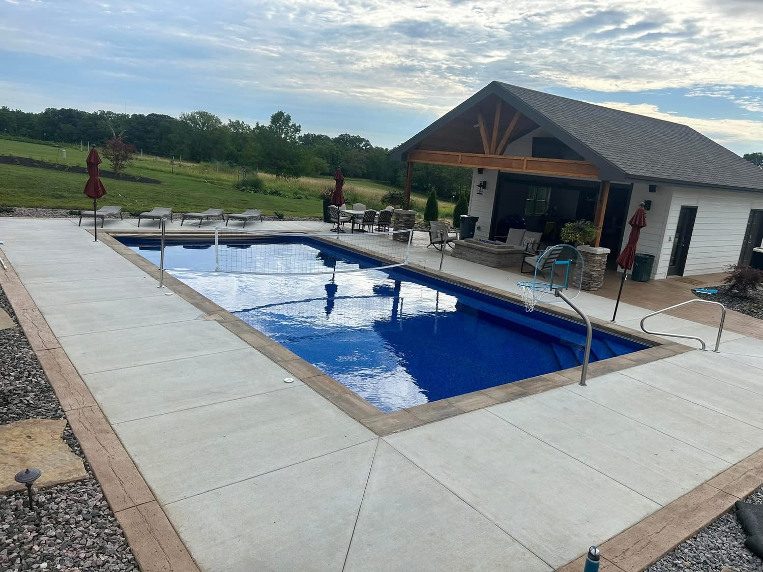 Custom in-ground pool with pool house and lounge area in Omaha Nebraska